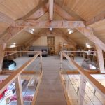 Espace mezzanine avec espace d&eacute;tente et 2 lits une personne superpos&eacute;s.